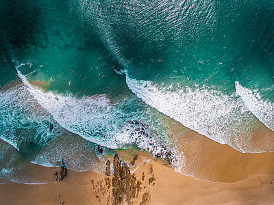 aerial shot of green and white body of water thumbnail