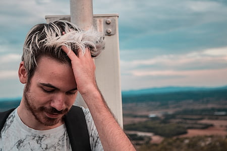 man combing hair with hand thumbnail