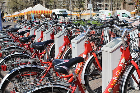 orange bicycle lot parked during daytime thumbnail