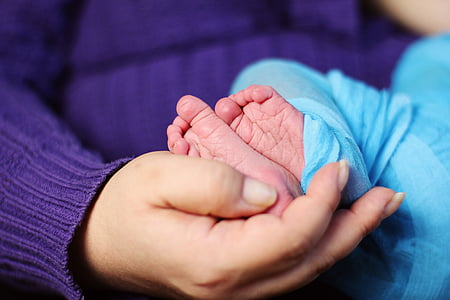 person holding baby's feet thumbnail
