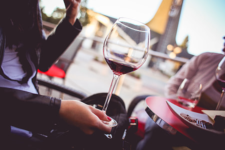 Girl Holding a Glass with Red Wine thumbnail