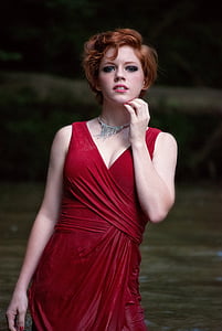woman wearing red v-neck sleeveless top thumbnail