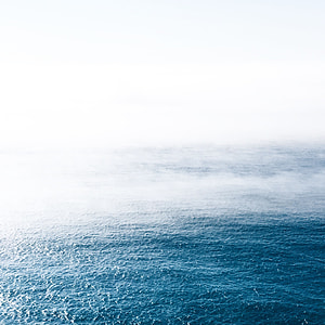 body of water with smoke during daytime thumbnail