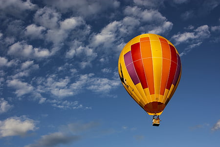 yellow and red hot-air balloon on sky thumbnail