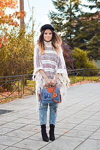 woman standing on gray pavement outdoors thumbnail