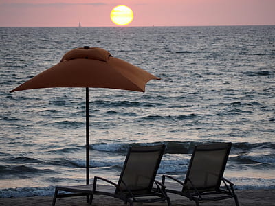 lounge chairs near shore thumbnail