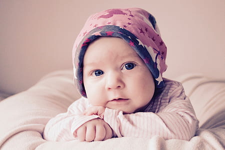 baby on white textile thumbnail