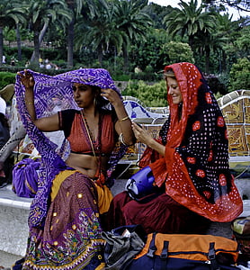 two women wearing assorted-color shawls o thumbnail