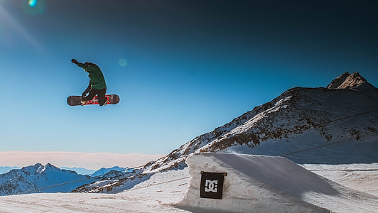 person riding on snowboard during daytime thumbnail