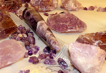 purple gemstones beside brown gemstone thumbnail