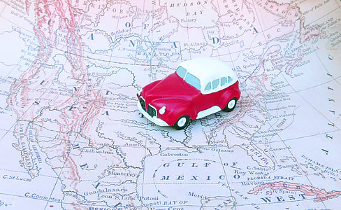 red and white car scale model on map thumbnail