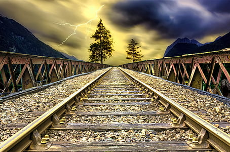 photography of gray train rails thumbnail