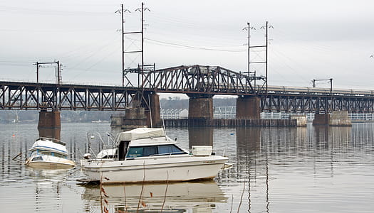 Small boats in the Susquehanna river after a storm. thumbnail