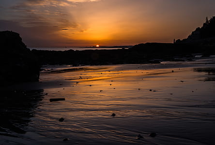 body of water near sunset thumbnail