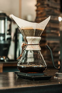 clear glass flask with coffee thumbnail