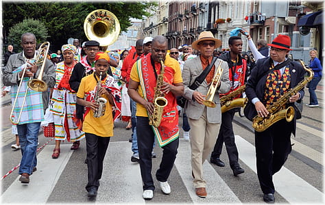 group of people holding musical instruments taken at daytime thumbnail
