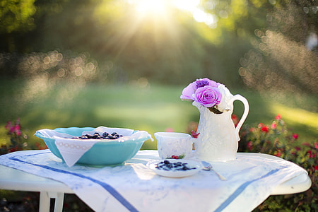 white ceramic tea cups and pitcher on white plastic table thumbnail