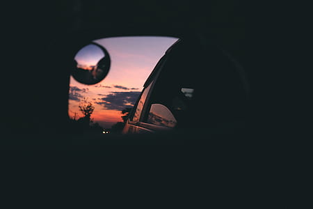 silhouette of a car on side mirror view thumbnail