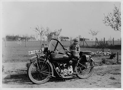 grayscale photo of boy riding motorcycle thumbnail
