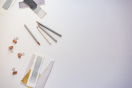 gray pencils near clips and envelope thumbnail