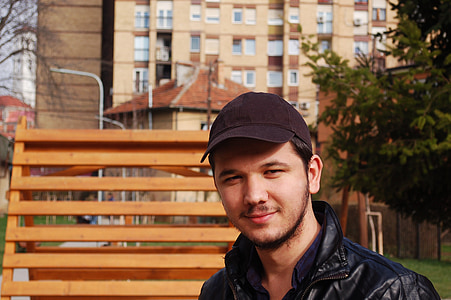 smiling man posing for photo thumbnail