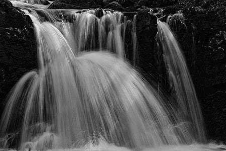 low angle of waterfalls near rocks thumbnail