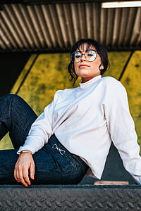 woman wearing eyeglasses taking photo inside the room thumbnail