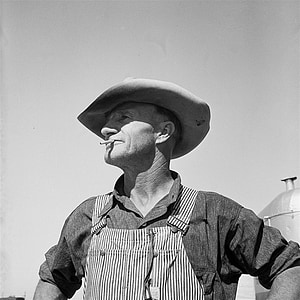 grayscale photo of man with cigarette in mouth thumbnail
