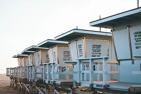 white wooden houses on dock near sea water thumbnail