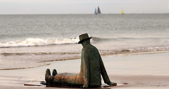 gray statue of a man thumbnail