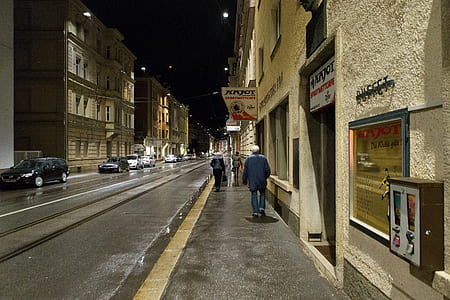 people walking along sidewalk thumbnail