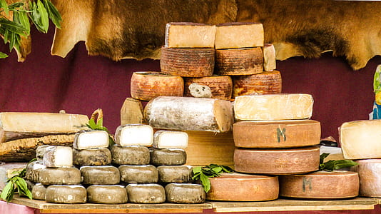 photo of stack cheese lot on wooden surface thumbnail
