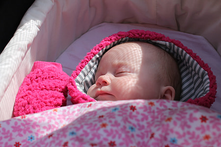 baby sleeping in bassinet thumbnail