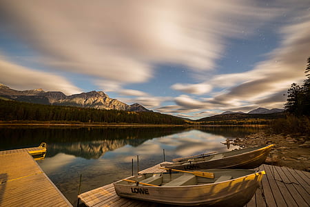 brown wooden boat near body of water thumbnail