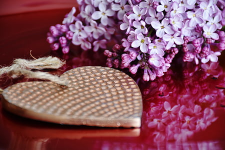purple flower centerpiece near gold-colored heart pendant thumbnail