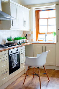 kitchen with white chair and indoor plants thumbnail