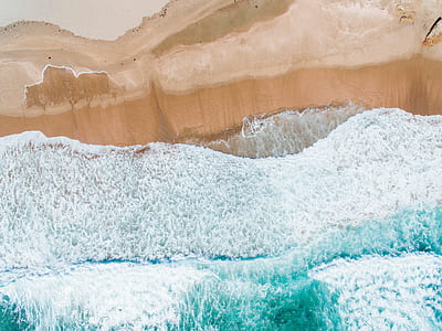 body of water splashing on brown rock thumbnail