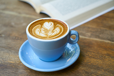 blue ceramic teacup on saucer filled with coffee thumbnail