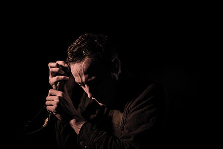 person holding microphone in both hand thumbnail