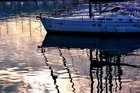 white boat on body of water thumbnail