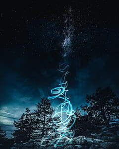 silhouette of trees and waterfalls under stars thumbnail