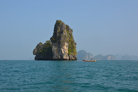 rock monolith under blue sky thumbnail