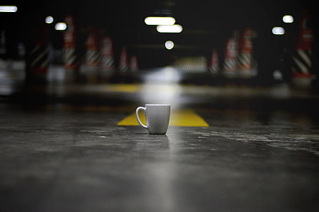 White Ceramic Coffee Cup on the ground thumbnail