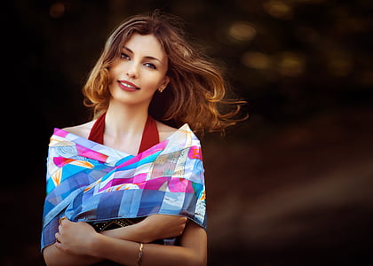 closeup photo of a woman wearing blue and pink top thumbnail