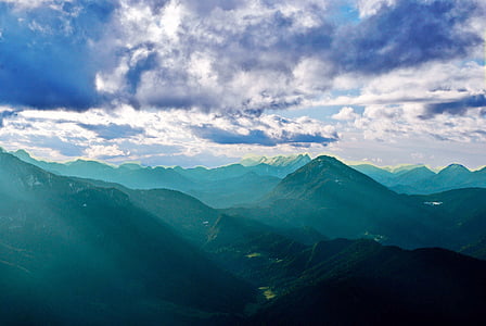 sun rays shining upon mountain thumbnail