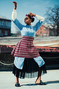 Woman Wearing Blue and Maroon Dress thumbnail