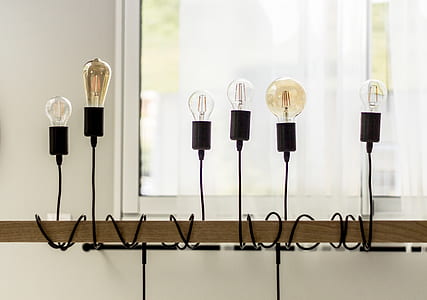 light bulbs fixed on wooden post thumbnail