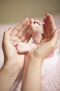 person holding baby's feet thumbnail