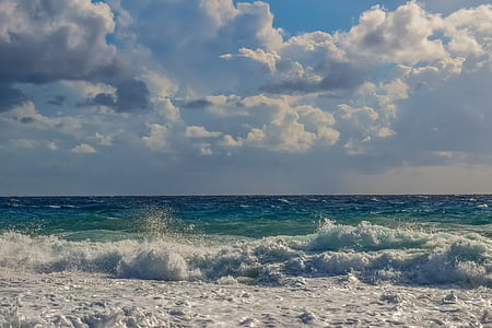 ocean wave under cloudy sky during daytime thumbnail