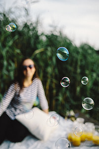 Having fun with soap bubbles in the nature thumbnail